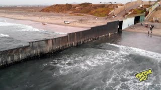 Migrants Cross USMexico Border From Tijuana to San Diego [upl. by Darom]