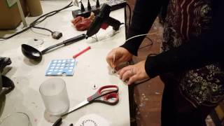 How to adhere a wick to a candle container [upl. by Plumbo]