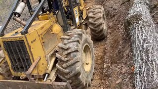 Caterpillar 518 Skidder with some heavy skids [upl. by Nnylrats]