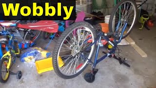 How To Straighten A Wobbly Bicycle WheelTutorial [upl. by Eibmab]