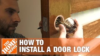 How to Install a Door Lock  The Home Depot [upl. by Revlys]