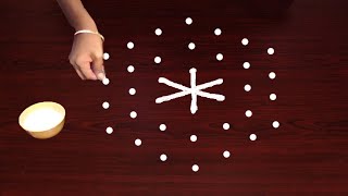 Easy Rangoli with 7X4 Dots  Simple rangoli use dots amp lines telugu muggulu  Rangoli Latest Designs [upl. by Hayalat71]