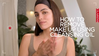 How to remove makeup using a cleansing oil  Clarins [upl. by Swanhilda685]